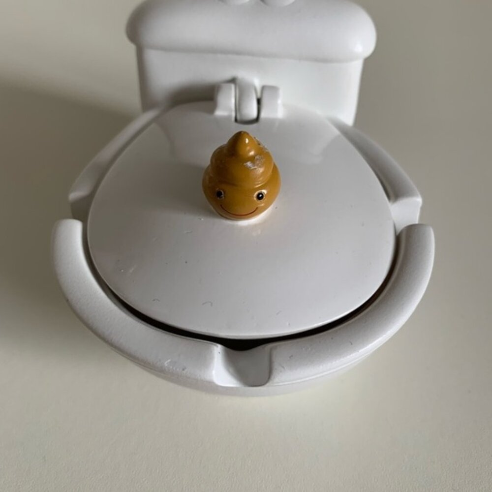 White Toy Toilet with Cute Poo